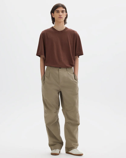 MHL. Parachute Trousers — relaxed-cut cotton poplin with pleated knee detailing, corozo buttons, drawstring waist. 100% cotton, made for movement. | oldpinetreeswear