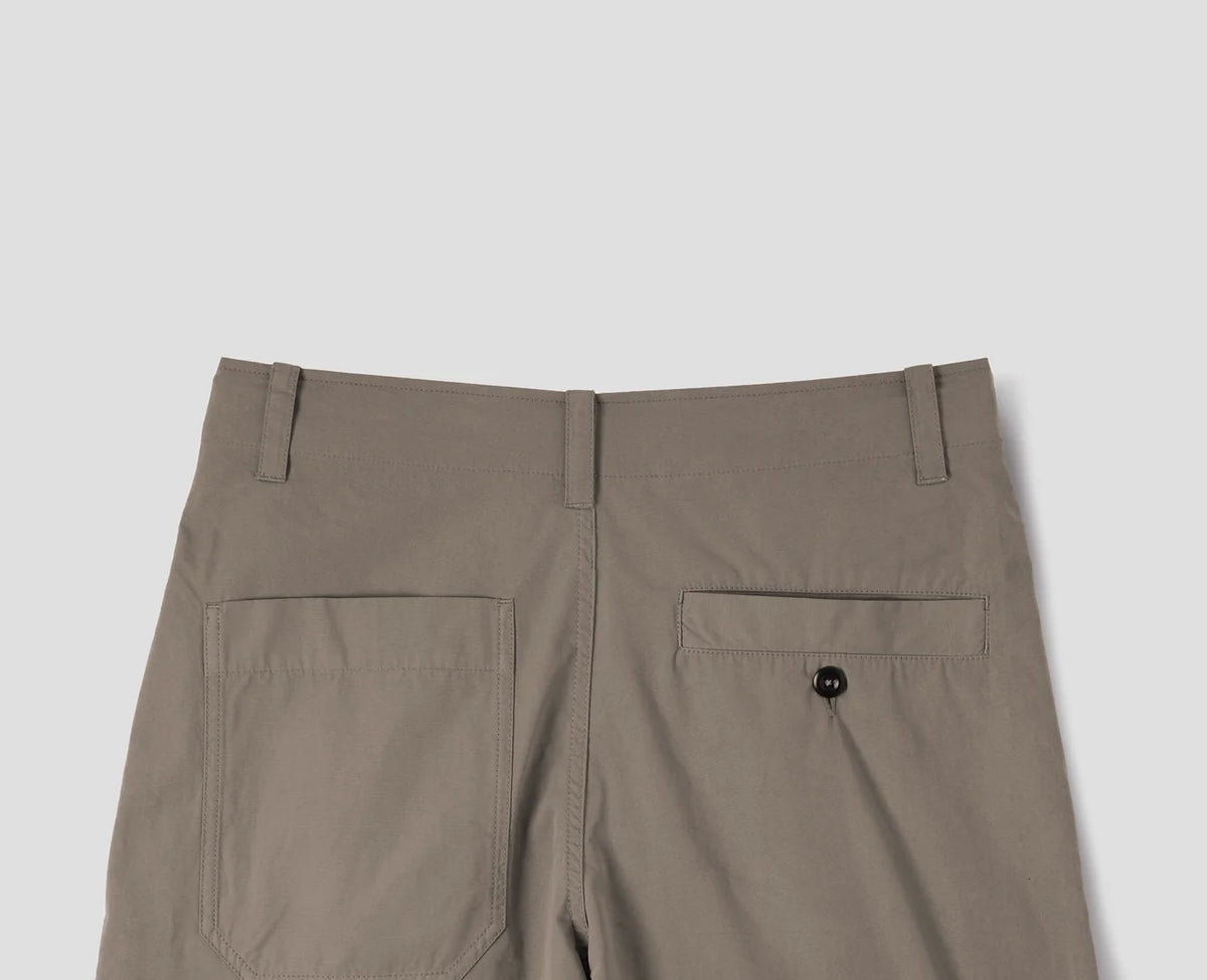 MHL. Parachute Trousers — relaxed-cut cotton poplin with pleated knee detailing, corozo buttons, drawstring waist. 100% cotton, made for movement. | oldpinetreeswear
