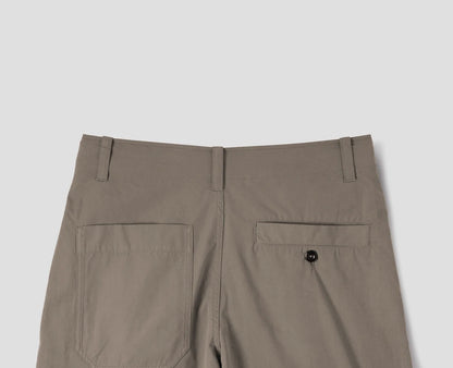 MHL. Parachute Trousers — relaxed-cut cotton poplin with pleated knee detailing, corozo buttons, drawstring waist. 100% cotton, made for movement. | oldpinetreeswear