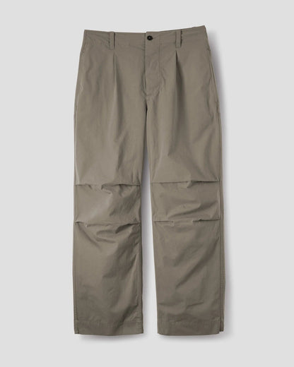 MHL. Parachute Trousers — relaxed-cut cotton poplin with pleated knee detailing, corozo buttons, drawstring waist. 100% cotton, made for movement. | oldpinetreeswear